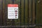 London, United Kingdom - April 27, 2020: Virus prevention advice safety sign on fence in Lewisham park due to coronavirus covid-19