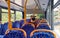 London, United Kingdom - August 30, 2020: Unknown passenger travelling on public transport bus, mouth virus mask covering his face