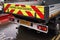 London, United Kingdom - February 01, 2019: Highway maintenance lorry truck standing on wet asphalt road near construction site,