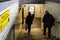 London, United Kingdom - February 01, 2019: Passengers walking down the stairs at pedestrian subway leading to other platform at