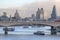 LONDON, UNITED KINGDOM - JANUARY 15: Cannon Railway bridge over river Thames with cruising ship and Cannon street station, on