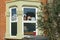 London, United Kingdom - May 04, 2020: Hand made paper rainbows displayed in window of house in Lewisham, expressing gratitude to