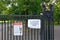 London, United Kingdom - May 08, 2020: Virus prevention advice safety sign on entrance gate in Greenwich park due to coronavirus
