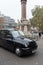 LONDON, UNITED KINGDOM - NOVEMBER 23, 2018: Taxi black cab near Crimea and Indian Mutiny memorial