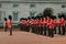 LONDON, UNITED KINGDOM - October 25, 2013: Officers and soldiers of the Coldstream Guards march in front of Buckingham Palace duri