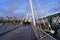London, United Kingdom: people walking on the Golden Jubilee Bridge