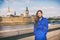 London woman european city traveler in blue trench coat outerwear at famous UK travel destination, Westminster Big Ben