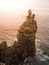 Londrangar, rock lava formation in the sea. Eroded basalt cliffs in the wild sea at coastline on Sneafellsnes peninsula