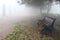 Lone bench over mist