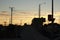 Lone bicycle cyclist riding across a city bridge on a summer day after work riding into the sunset, Melbourne city, Victoria,