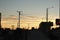 Lone bicycle cyclist riding across a city bridge on a summer day after work riding into the sunset, Melbourne city, Victoria,