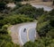 A lone biker drives along winding Mulholland highway in southern California.