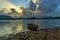 A lone boat in the shore of umiam lake during sunset time