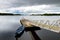 Lone boat tied to small pier on Lough Leane, the largest and northernmost of the lakes of Killarney National Park, County Kerry, I