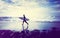 Lone Businessman by the Beach with Surfboard