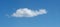 Lone cloud in tropical blue sky panorama