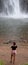 Lone Creek Falls: woman photographing the dramatic waterfalls in the Blyde River Canyon, Panorama Route, South Africa