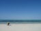 Lone cyclist on bike on beautiful beach, Jambiani, Zanzibar, Tanzania