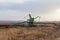 A lone excavator in the steppe
