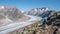 A lone female hiker treks next to the famous aletsch glacier