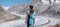 A lone female hiker treks next to the famous aletsch glacier