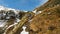 Lone female traveler hiking in the snow with a backpack. Winter snowy mountains in Pyrenees