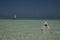 Lone figure on beach in Michamwi-Pingwe Zanzibar,