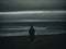 Lone Figure Standing on Dark Beach at Night. Generative AI.