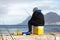 Lone fisherman fishing from Kalk Bay Harbour