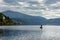 A lone fisherman in a motor boat on lake Millstatt, Austria.