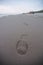 Lone footprint at beach