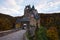 Lone guard sits in a chair at the Eltz Castle gate