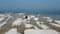 Lone guitarist playing on rocky landscape from above