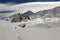 A lone hiker on the Tilicho Lake trek on the Annapurna circuit, walking through snow, .