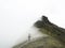 Lone hiker on top of mountain