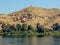 A lone house stands on the summit of a hill above the River Nile in Egypt