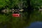 A lone kayak sits in a a calm cove