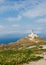 Lone lighthouse on the hillside. Mykonos.Greece