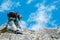 Lone male mountain climber on summit