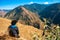 Lone man with flowing hair, savoring the breathtaking Himalayan Mountain scenery. Serene moment amid nature