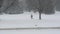 Lone man walking in snow storm