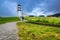 A Lone Man Watching Alnes Lighthouse at Godoy Island near Alesund