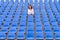 Lone middle-aged woman in a stadium