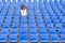 Lone middle-aged woman in a stadium