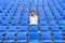 Lone middle-aged woman in a stadium