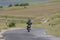 Lone motorcyclist traveling on a large engine, the road is deserted, fun is guaranteed