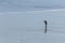 Lone Photographer on deserted beach in North Cornwall