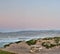 Lone picnic table against the dunes.