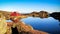 A Lone Red Cabin on The Top of Mountain