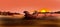 Lone rock in african landscape at sunset